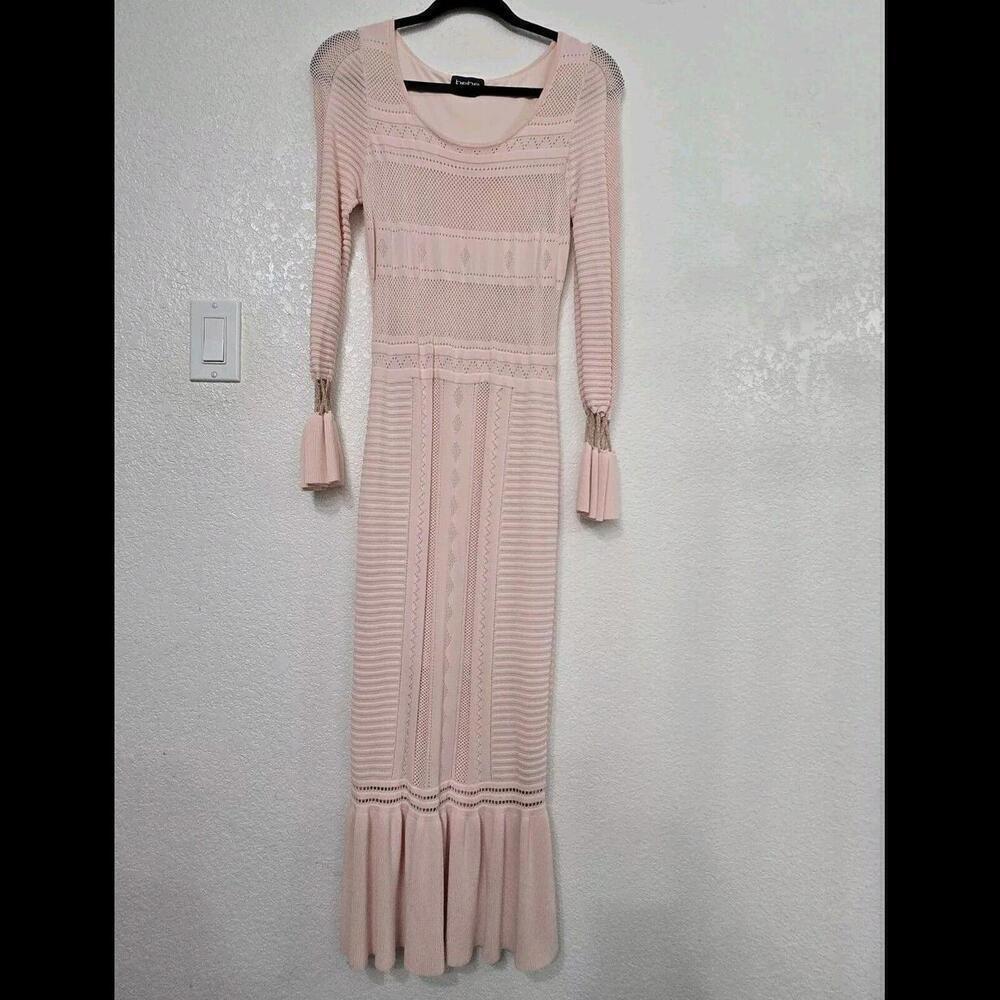 The  Bebe Crochet Midi Dress speaks the language of love and elegance.